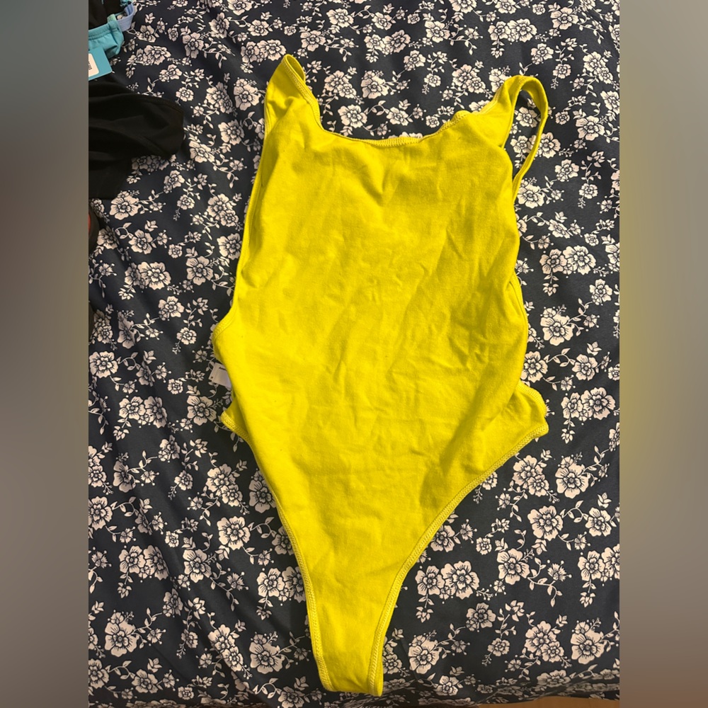 American Apparel

 Neon  Yellow One-Piece Swimsuit
Never worn